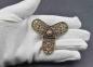 Preview: Kleeblattfibel der Rus Wikinger aus Bronze auf Hand